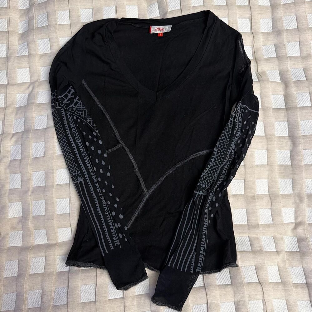 VTG Black long sleeve top with white geometric and text patterns on sleeves